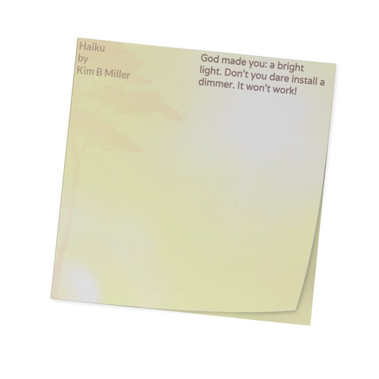Sticky notes with a haiku by Kim B Miller and a light background, angled view.