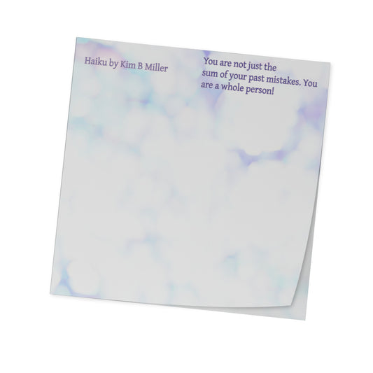 A 3" x 3" sticky note pad featuring a haiku by Kim B Miller printed on the front, subtle colors, angled view.
