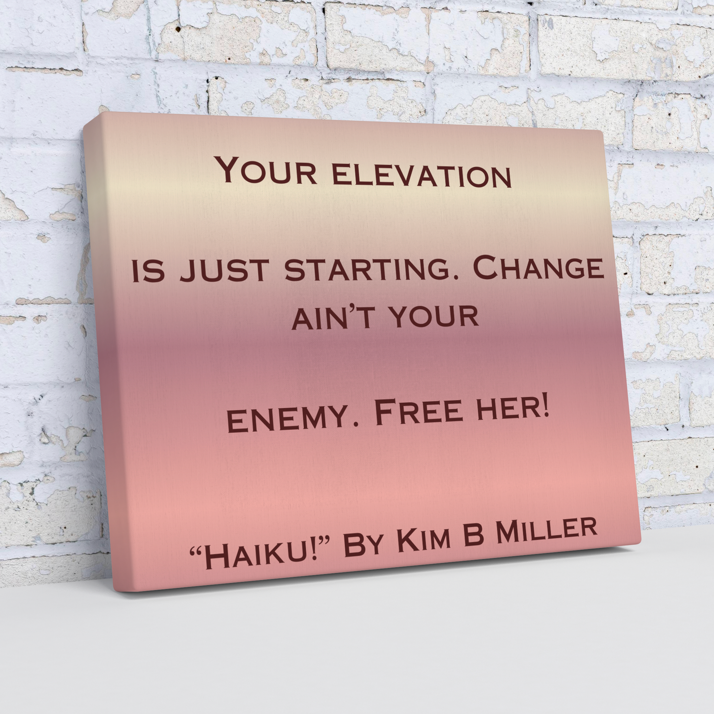 A canvas with a warm rose gold gradient, featuring an original haiku by Kim B Miller, angled view. 
